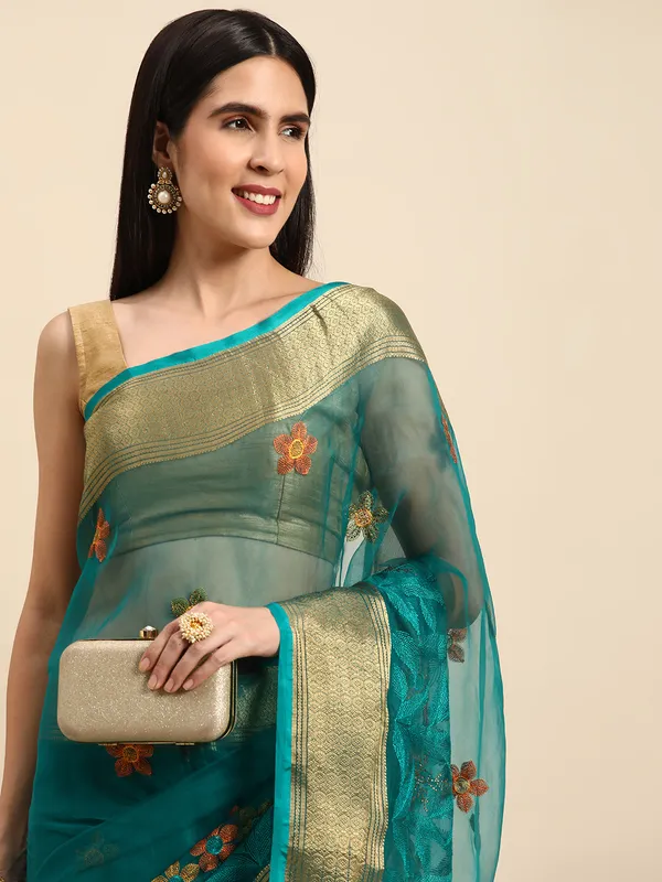 Indian_Women_Turquoise_Blue_Orgenza_Fancy_border_with_Embroidery_work