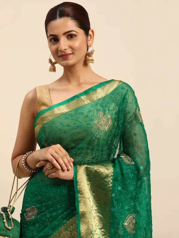 Indian_Women_Green_Orgenza_Fancy_border_with_Embroidery_work