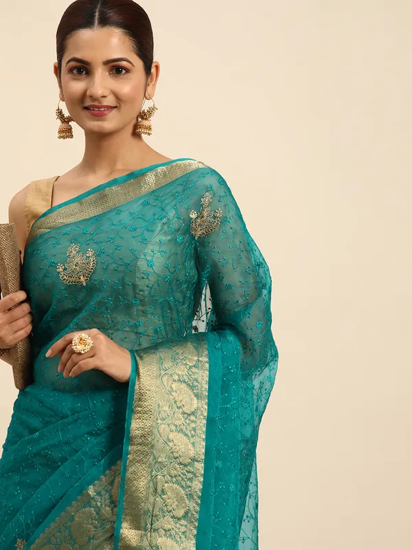 Indian_Women_Turquoise_Blue_Orgenza_Fancy_border_with_Embroidery_work