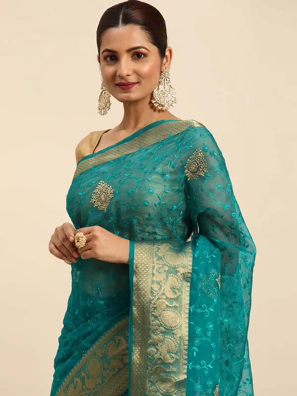 Indian_Women_Turquoise_Blue_Orgenza_Fancy_border_with_Embroidery_work