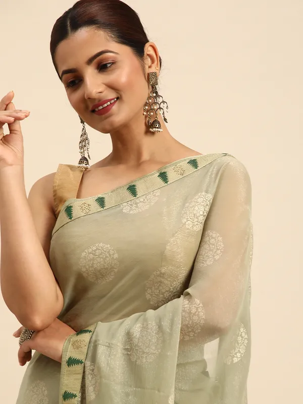 Indian_Women_Lite_Green_Shimmer_Chiffon_Fancy_Border_with_Swarovski_&_foil_work