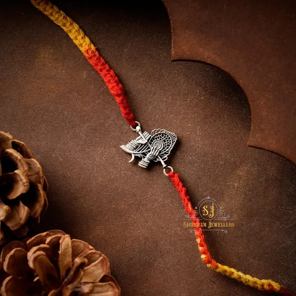 Silver_925_Sterling_Rakhi_For_Brother_God_Rakhi_Raksha_Bandhan_Pure_Cotton_For_Men_Boys_Kids_Rakhi_With_Roli_Chawal_(Krishna_Bansuri)