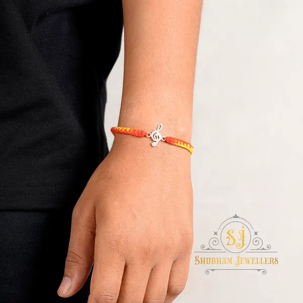 Silver_925_Sterling_Rakhi_For_Brother_Rakhi_Raksha_Bandhan_Pure_Cotton_For_Men_Boys_Kids_Rakhi_With_Roli_Chawal_(Musical_Note)