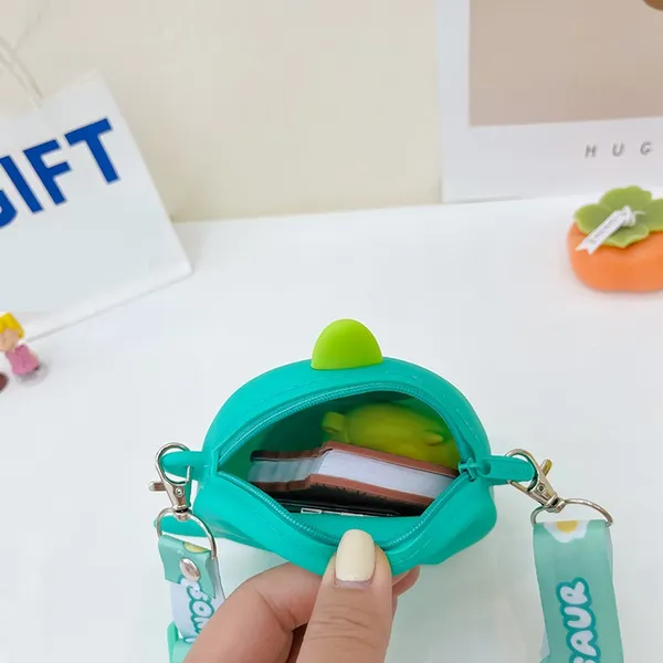 Cute_Mini_Dino_Silicone_Sling_Bag_With_Mirror,_Comb,_And_Key_Chain_-_Adorable_And_Stylish
