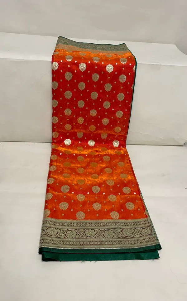 Humairah_Presents_Orange_Satin_Silk_Zari_Booti_and_Contrast_Green_2D_Zari_Border_and_Heavy_Floral_Jaal_Pallu_Banarasi_Saree_with_Green_Blouse