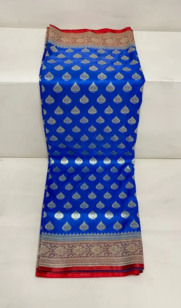 Humairah_Presents_Blue_Satin_Silk_Silver_Zari_Pan_Booti_and_Contrast_Red_Zari_Border_and_Heavy_Silver_Zari_Floral_Anchal_Banarasi_Saree_with_Red_Blouse