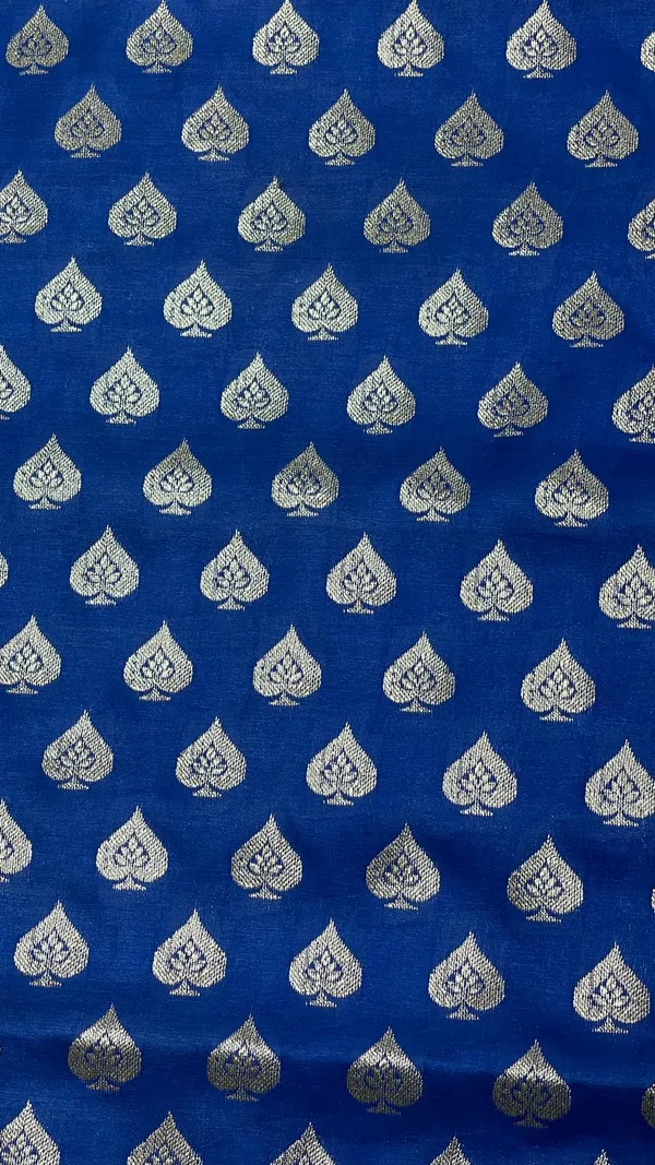 Humairah_Presents_Blue_Satin_Silk_Silver_Zari_Pan_Booti_and_Contrast_Red_Zari_Border_and_Heavy_Silver_Zari_Floral_Anchal_Banarasi_Saree_with_Red_Blouse