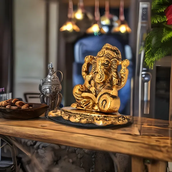 Metal_Ganpati_idol_with_Reading_Book_Decorative_Showpiece_-_8_Cm_(Metal_Color_Gold)