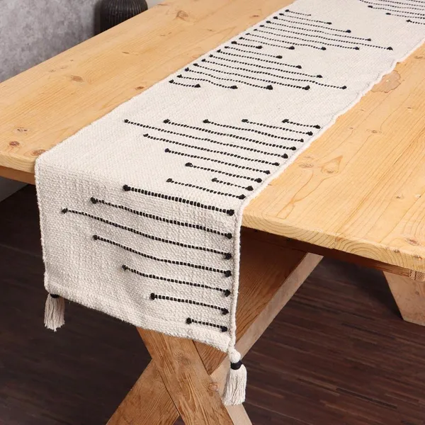 https://d1311wbk6unapo.cloudfront.net/NushopCatalogue/tr:f-webp,w-600,fo-auto/_Modern_Boho_Cotton__6_Seater_Table_Runner__Heat_Resistant__Ivory_-_Season_sale_4X8JW7TZSZ_2023-01-27_1.jpg__Aaho Decor