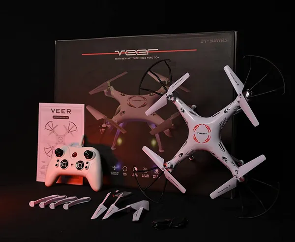 https://d1311wbk6unapo.cloudfront.net/NushopCatalogue/tr:f-webp,w-600,fo-auto/_VEER_360___ALTITUDE_HOLD_DRONE___DOUBLE_BATTERY_DOUBLE_FUN___Drone_With_2.4GHZ_Remote_Control__Orange__U0HC83YQI3_2023-06-28_1.jpg__Believers Emporium