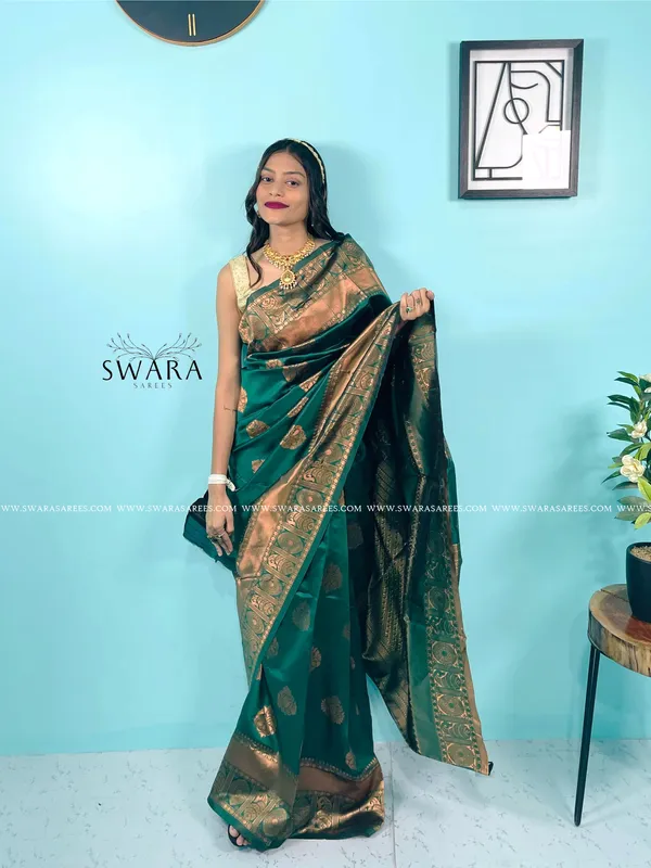 https://d1311wbk6unapo.cloudfront.net/NushopCatalogue/tr:f-webp,w-600,fo-auto/_Womens_Banarasi_Silk_Zari_Woven_Saree_Woven_Unstiiched_Blouse_Piece_6L7LN38WBM_2023-05-15_1.jpg__Swara Saree