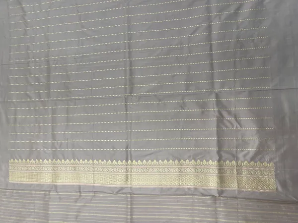 Humairah_Pure_Handwoven__Grey_Katan_Silk_Kadhwa_Gold_&_Silver_Swastik_Booti_with_Kadhwa_Zari_Border_and_Grey_Stripe_Blouse
