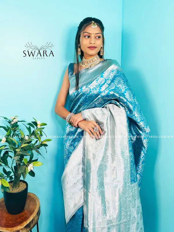 https://d1311wbk6unapo.cloudfront.net/NushopCatalogue/tr:f-webp,w-600,fo-auto/a51oCqje_1V83EYM8LC_2023-05-22_1.jpg__Swara Saree