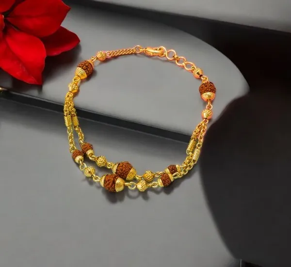 https://d1311wbk6unapo.cloudfront.net/NushopCatalogue/tr:f-webp,w-600,fo-auto/high_gold_plated_2_line_rudrax_rakhi_bracelet_J8D4ZNTDIP_2024-07-10_1.jpg