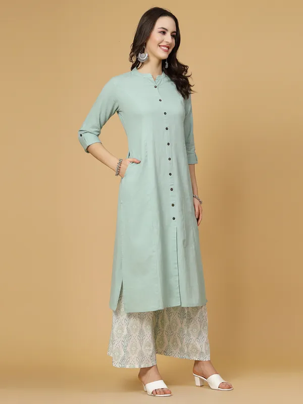 Green_Cotton_Solid_Kurta_With_Printed_Flair_Palazzo_Bottom_Set