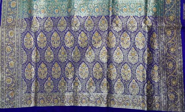 Humairah_Presents_Turqouise_Blue_Stone_Work_Golden_Zari_Booti_Afli_Mina_Jaal_with_Alfi_Boota_Pallu_Zari_Border_and_Blue_Blouse_Banarasi_Saree