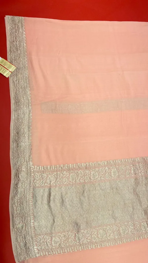 Humairah_Pure_Handwoven_Peach_Plain_Khaddi_Georgette_Silver_Zari_Kadhwa_Border_and_Anchal_with_Peach_Blouse_Banarasi_Saree