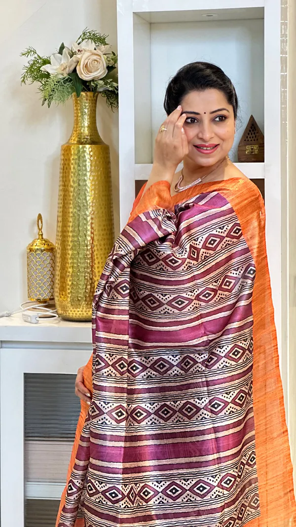 Barkha_Orange_&_Wine_–_Monsoon_Fresh_Diwali_Special_|_Soft_Tussar_Silk_Saree_with_Print,_Pallu_&_Zari_Border_&_Contrast_Print_Blouse_with_Tassels