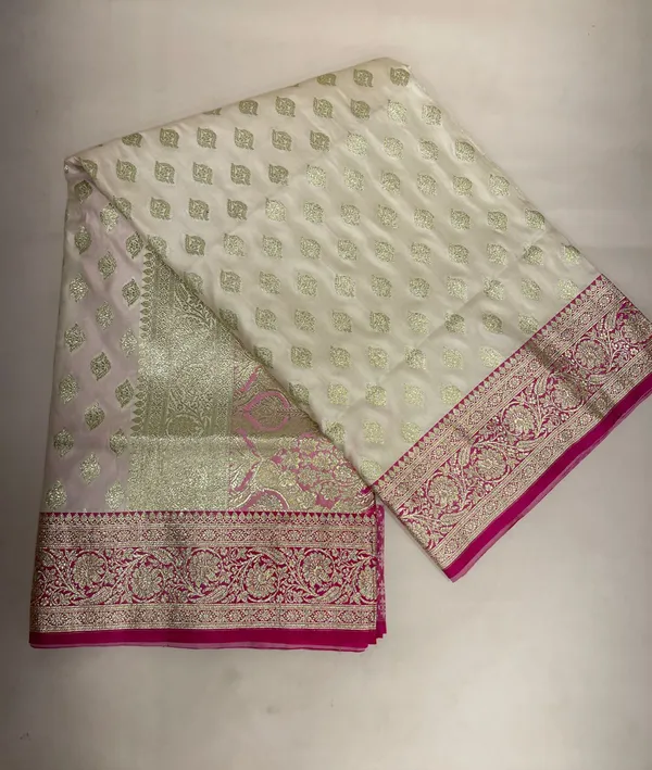 Humairah_Presents_Off-White_Katan_Silk_Floral_Light_Gold_Zari_Booti_with_Contrast_Magenta_Floral_Pallu_Banarasi_saree_and_Magenta_Blouse