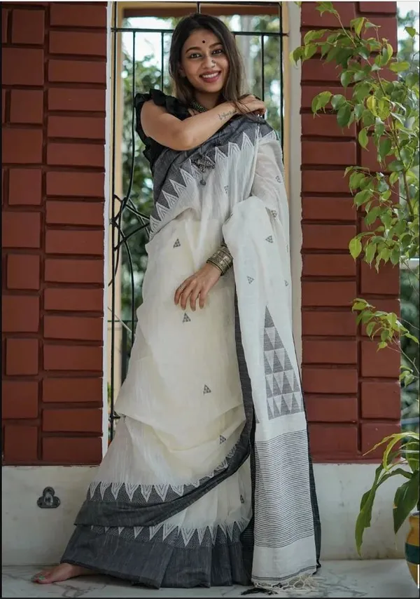 https://d1311wbk6unapo.cloudfront.net/NushopCatalogue/tr:f-webp,w-600,fo-auto/undefined_1690628498133_c6hcusnkxandz9e.jpg__INDIAN LINEN SAREE