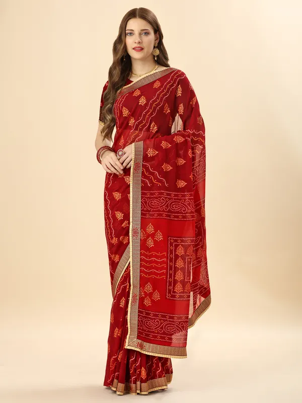 Red_colour_georgette_traditional_bandhej_printed_saree_with_diamond_embellished_border