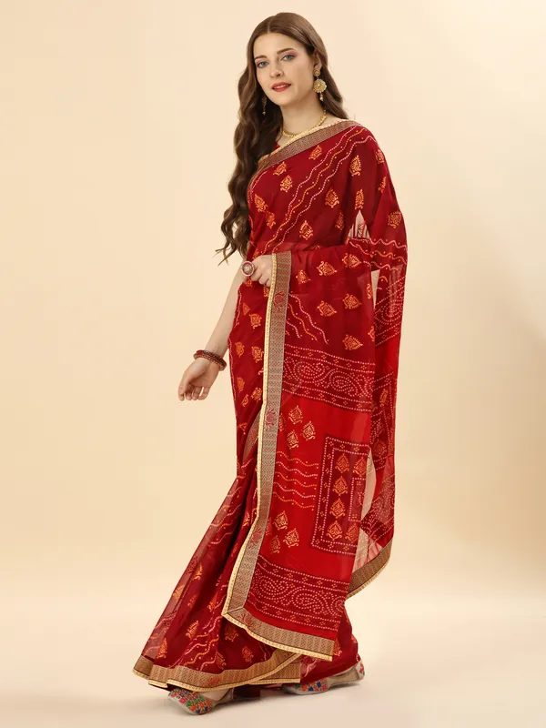 Red_colour_georgette_traditional_bandhej_printed_saree_with_diamond_embellished_border