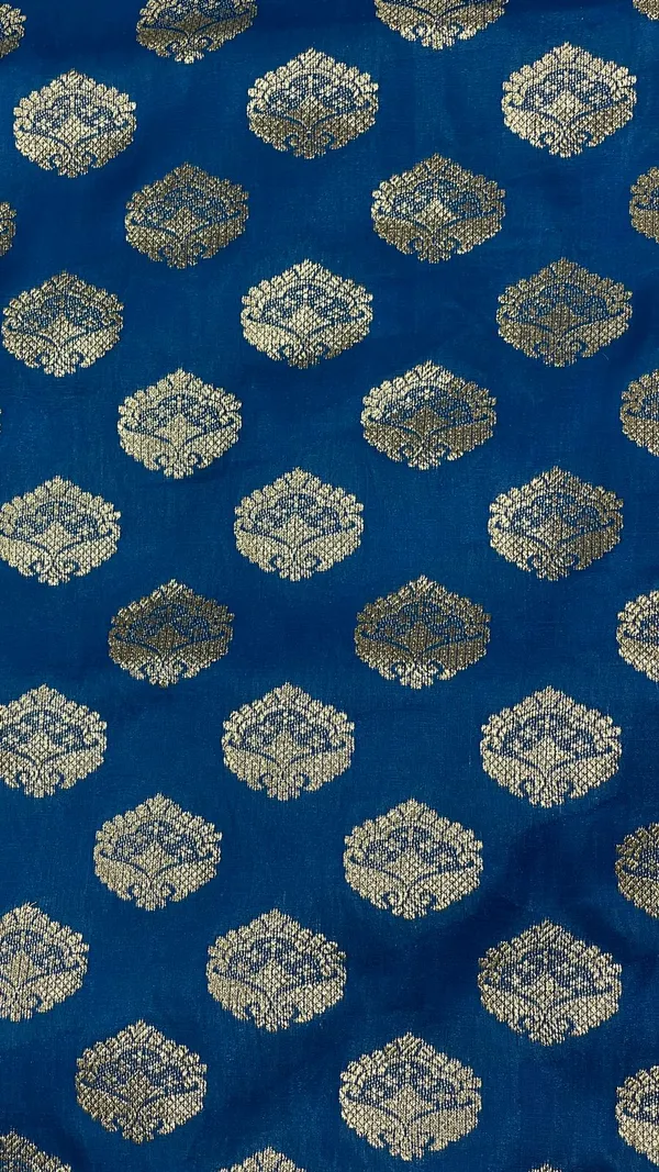 Humairah_Presents_Blue_Satin_Silk_Silver_Zari_Floral_Boota_and_Contrast_Red_Zari_Border_and_Heavy_Silver_Zari_Floral_Anchal_Banarasi_Saree_with_Red_Blouse