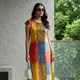 Block strokes in rust, mustard, blue, and olive.__Wama Trendz