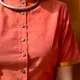 Coral / Rust Orange base with Golden Yellow border accents__Akshya Marketing And Consulting