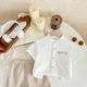White Shirt & Beige Striped Shorts