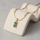 Gold with green stone