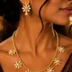 Gold Toned With White Pearl Centres__AMBELIS