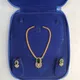 Radiant Gold with Deep Emerald Green oval stone and Clear CZ accents