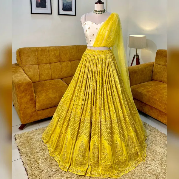 https://d1311wbk6unapo.cloudfront.net/NushopCatalogue/tr:w-600,f-webp,fo-auto/Colour_of_Haldi_Sequin_Georgette_Lehenga_Choli_UHD4G66EMM_2023-01-15_1.jpg