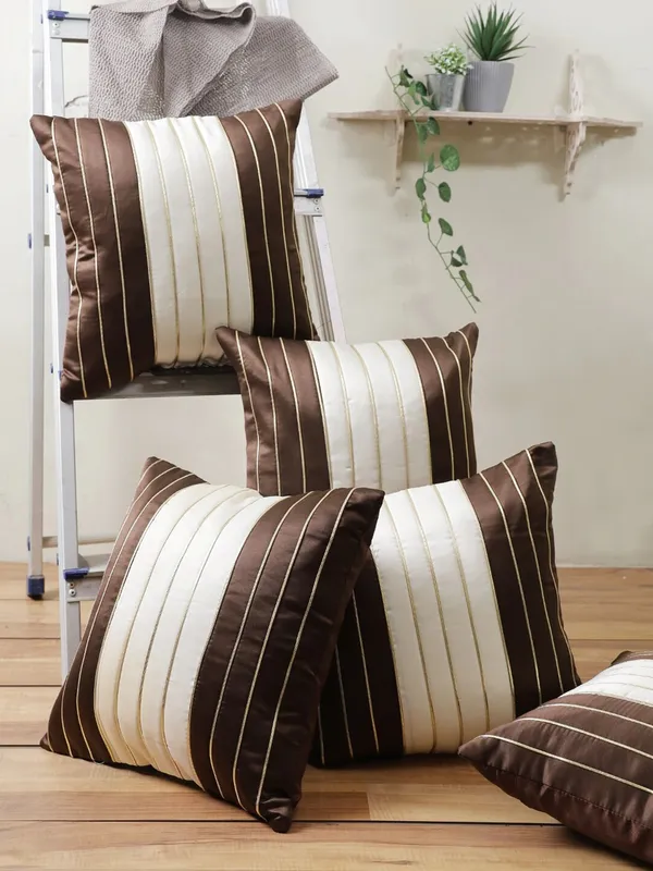 https://d1311wbk6unapo.cloudfront.net/NushopCatalogue/tr:w-600,f-webp,fo-auto/Gifts_Island®_Set_of_5_Brown___Cream_Polyester_Silk_Gold-Tone_Striped_Square_Cushion_Covers_16_inch_x_16_inch__40.64_x_40.64_cm__Brown__4RF7HE4JVT_2022-08-22_1.jpg