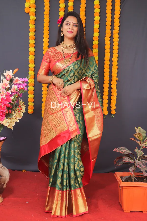 https://d1311wbk6unapo.cloudfront.net/NushopCatalogue/tr:w-600,f-webp,fo-auto/Wedding_Edition_Subtitle_Gold_Woven_GREEN___Kanjivaram_Saree_WH9SXJXJU8_2023-01-29_1.jpeg